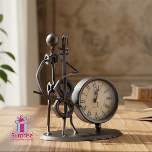 ⁦ديكور معدن على شكل عازف موسيقى مع ساعة⁩ - الصورة ⁦1⁩