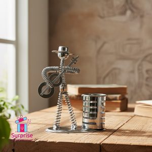 ⁦مقلمة معدن على شكل شخصية موسيقية⁩ - الصورة ⁦1⁩