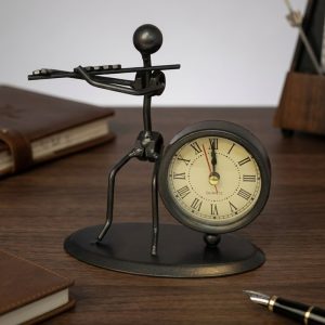 Industrial Metal Flute Player Clock - Image 1